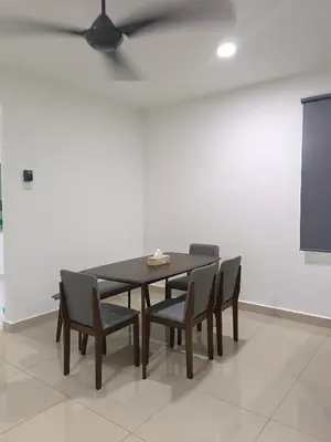 a dining room table with chairs and a ceiling fan at 8Pax comfortable setia residen in Sitiawan