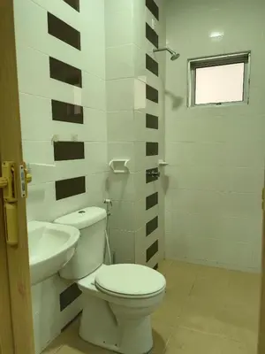 a bathroom with a toilet and a sink at 8Pax comfortable setia residen in Sitiawan