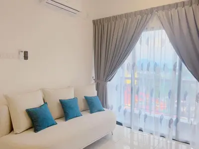 a living room with a couch and a large window at The Horizon Ipoh Blissful Homestay 2 in Ipoh