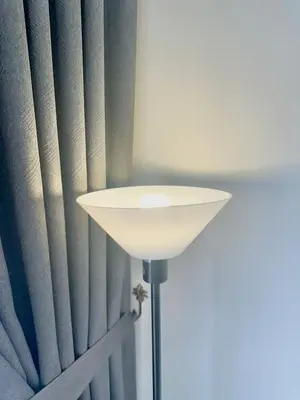 a white lamp in front of a blue curtain at The Horizon Ipoh Blissful Homestay 2 in Ipoh