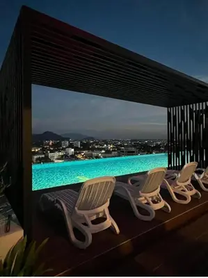 a group of chairs sitting on top of a swimming pool at The Horizon Ipoh Blissful Homestay 2 in Ipoh