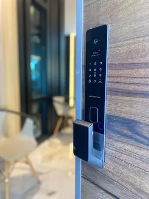 a close up of a door with a remote control at LYL Jaccuzi Private Pool House - 16PAX in Ipoh