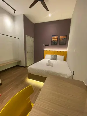 a bedroom with a bed and a ceiling fan at LYL Jaccuzi Private Pool House - 16PAX in Ipoh