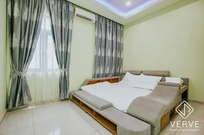 a bedroom with a bed and a window with curtains at Ipoh Garden Luxury House By Verve (14pax) in Ipoh