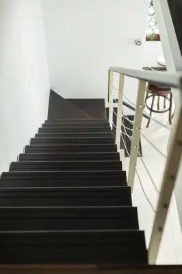 a set of stairs with a table and a table at Maritime Seaview Comfy Suite Penang with TVbox,Pool,Freewifi,2-8pax in Jelutong