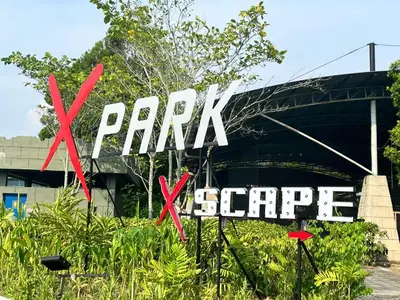 a sign that says park escape in front of a bridge at Sunway Alpine Suites near Onsen and Themepark Tambun Ipoh by IWH in Ipoh
