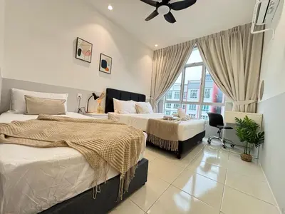 a bedroom with two beds and a window at Ipoh Anderson Town Suites with 2 Parking by IWH in Ipoh