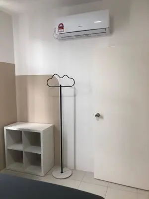 a white room with a fan and a white shelf at Ipoh Anderson Suites by Migliore in Ipoh