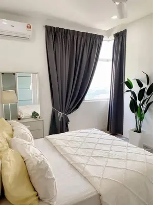 a bedroom with a large bed and a window at Blubelle Apt Near Lake Garden Zoo With Wifi Netflix in Taiping