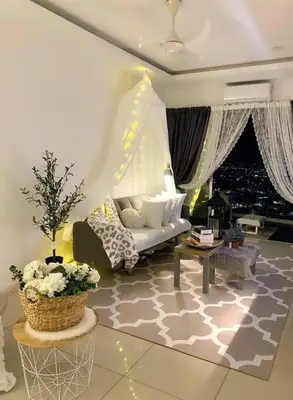 a living room with a couch and a table at Blubelle Apt Near Lake Garden Zoo With Wifi Netflix in Taiping