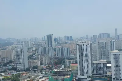 an aerial view of a city with tall buildings at Aesthetic Urban Suite With Infinite Pool & Gym in Jelutong