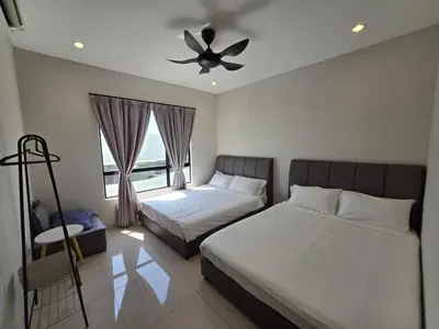 a bedroom with two beds and a ceiling fan at Manhattan Condominium - Jalan Pasir Puteh - Ipoh in Ipoh