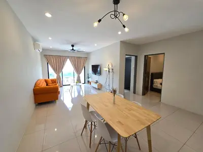 a living room with a table and a couch at Manhattan Condominium - Jalan Pasir Puteh - Ipoh in Ipoh