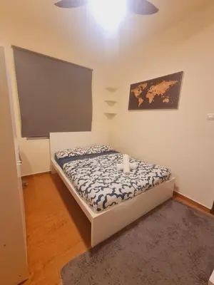 a small bedroom with a bed in a room at UniVilla- Ideal Family Home for 18pax in Gelugor