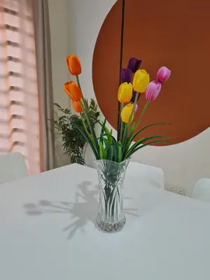 a vase filled with colorful flowers sitting on a table at UniVilla- Ideal Family Home for 18pax in Gelugor