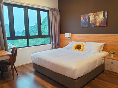 a bedroom with a bed with a flower on it at Lost World of Tambun, Sunway Onsen Studio, 1BR, 2-4pax in Tambun
