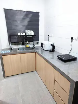 a kitchen with a counter with a microwave on it at OV06-3room Georgetown Seaview Pg in George Town