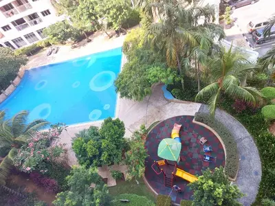 an overhead view of a swimming pool with a roller coaster at OV06-3room Georgetown Seaview Pg in George Town