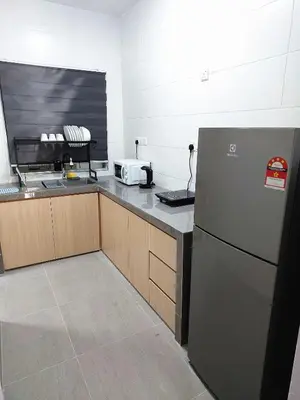 a kitchen with a refrigerator and a counter top at OV06-3room Georgetown Seaview Pg in George Town