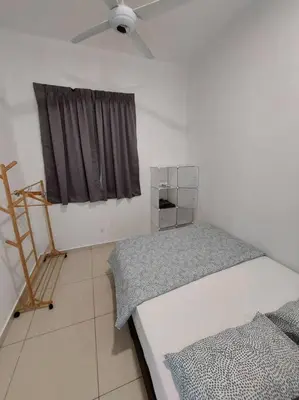 a bedroom with two beds and a ceiling fan at OV06-3room Georgetown Seaview Pg in George Town