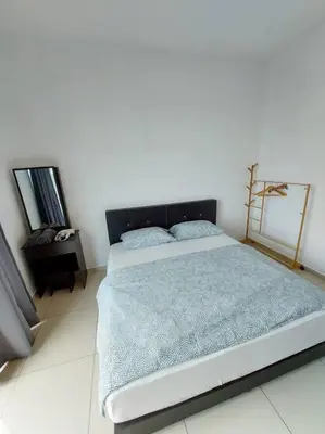 a bedroom with a large bed in a white room at OV06-3room Georgetown Seaview Pg in George Town
