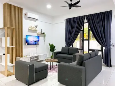 a living room with two couches and a tv at BrandNew Modern Cozy House@ALMA NEAR JUSCO in Bukit Mertajam