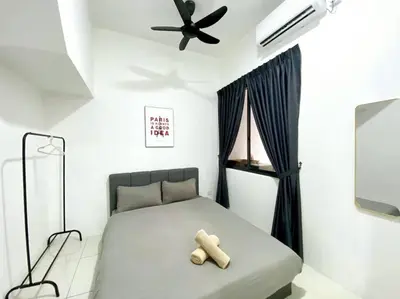 a bedroom with a bed with a teddy bear on it at BrandNew Modern Cozy House@ALMA NEAR JUSCO in Bukit Mertajam