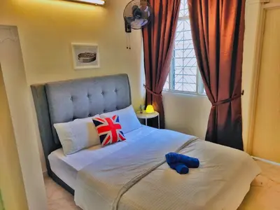 a bed with a stuffed animal on it in a bedroom at Queensbay Mall, Up to 5 Pax, 2 Bedrooms, 1 Bathroom, 1 Car Park by Star Home in Bayan Lepas