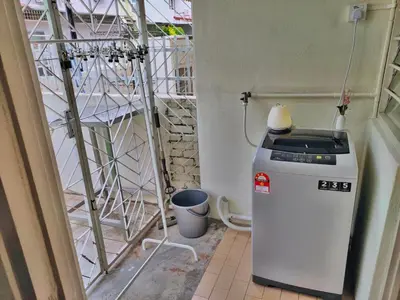 a small refrigerator in a corner of a room at Queensbay Mall, Up to 5 Pax, 2 Bedrooms, 1 Bathroom, 1 Car Park by Star Home in Bayan Lepas