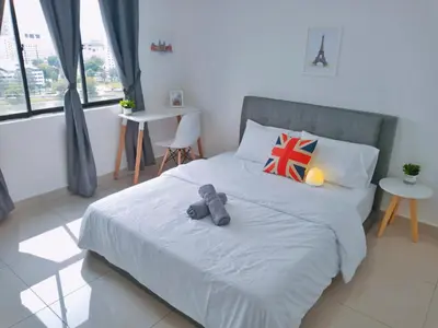 a teddy bear sitting on a bed in a bedroom at Georgetown, Up to 5 Pax, 2 Bedrooms, 1 Bathroom, 1 Car Park by Star Home in George Town