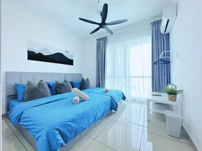 a blue bedroom with a blue bed and a ceiling fan at BM\u5927\u5c71\u811a Bandar Perda Metropol Service Apartment 3-minute To KPJ Hospital in Bukit Mertajam