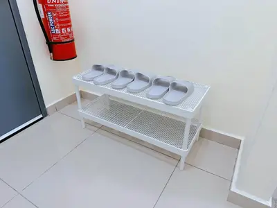 a small white table with gray cushions on it at BM\u5927\u5c71\u811a Bandar Perda Metropol Service Apartment 3-minute To KPJ Hospital in Bukit Mertajam