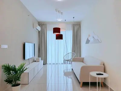 a living room with a couch and a tv at BM\u5927\u5c71\u811a Bandar Perda Metropol Service Apartment 3-minute To KPJ Hospital in Bukit Mertajam