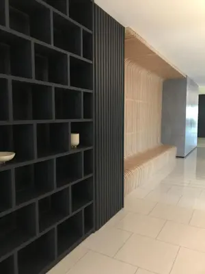 a room with black brick walls and a hallway at Luxury Seaview Private Elevator Near Island Hospital and Gurney plaza \u68b9\u57ce\u65e0\u654c\u6d77\u666f\u79c1\u4eba\u7535\u68af\u9760\u8fd1\u533b\u9662\u548c\u5546\u573a in Tanjong Tokong