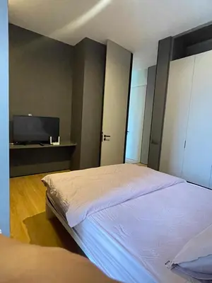 a bedroom with a bed and a flat screen tv at Luxury Seaview Private Elevator Near Island Hospital and Gurney plaza \u68b9\u57ce\u65e0\u654c\u6d77\u666f\u79c1\u4eba\u7535\u68af\u9760\u8fd1\u533b\u9662\u548c\u5546\u573a in Tanjong Tokong