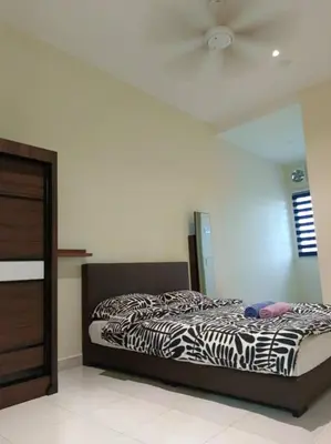 a bedroom with a zebra print bed and a ceiling at Homestay Sitiawan 53 in Sitiawan