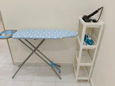 a desk with a blue cushion and a shelf at Homestay Sitiawan 53 in Sitiawan