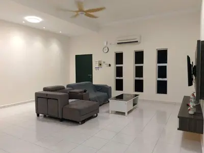 a living room with two couches and a ceiling fan at Homestay Sitiawan 53 in Sitiawan