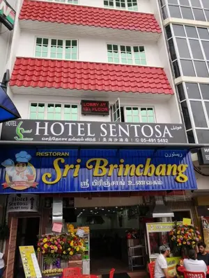 a hotel sign in front of a building at Hotel Sentosa in Brinchang