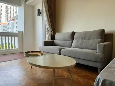 a living room with a couch and a coffee table at 2Beds Seaview Waterfront Straits Quay w/Free Carpark And Bathub in Tanjong Tokong