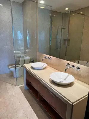 a bathroom with two sinks and a shower and a toilet at 2Beds Seaview Waterfront Straits Quay w/Free Carpark And Bathub in Tanjong Tokong