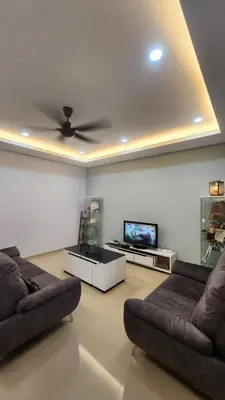 a living room with two couches and a flat screen tv at AY Homestay Midtown Falim in Ipoh