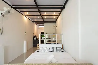 a room with three beds in a room at Casa for 2 - Private Studio Ipoh in Ipoh