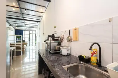a kitchen with a sink and a counter top at Casa for 2 - Private Studio Ipoh in Ipoh