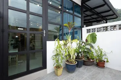 a group of potted plants sitting outside of a building at Casa for 2 - Private Studio Ipoh in Ipoh