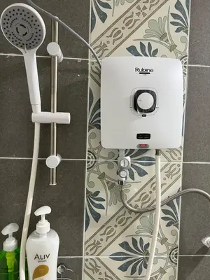 a bathroom with a soap dispenser on a wall at Ipoh Town Anderson Haru Suite 7 paxs 2R2B in Ipoh