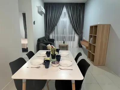 a white dining table with black chairs in a room at Ipoh Town Anderson Haru Suite 7 paxs 2R2B in Ipoh