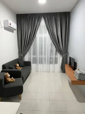a living room with a couch and a large window at Ipoh Town Anderson Hana Suite 7 paxs 2R2B in Ipoh