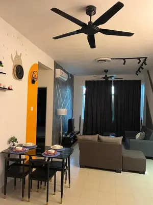 a living room with a couch and a ceiling fan at Ws Falim in Ipoh