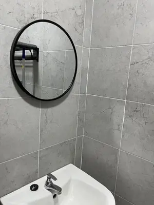 a bathroom with a sink and a mirror on the wall at Ws Falim in Ipoh